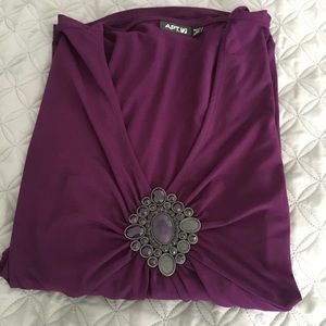 Attractive purple blouse with pretty jewel piece!